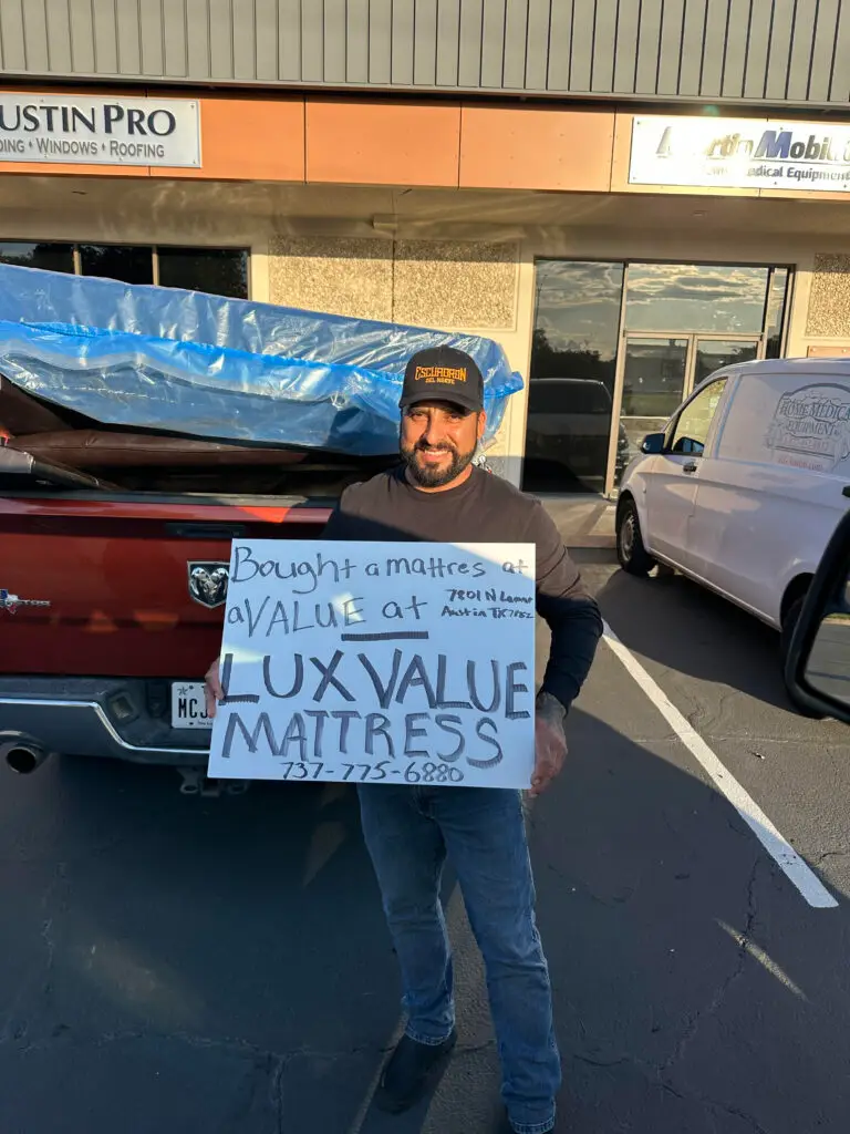 Customer picking up a queen mattress from Lux Value Mattress in North Austin